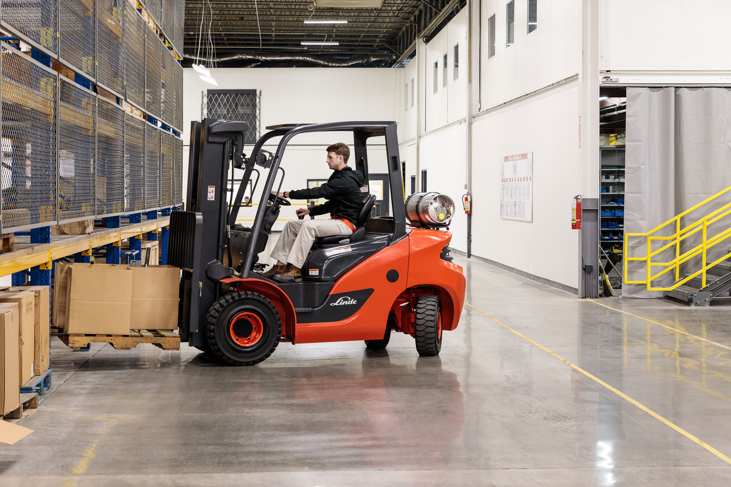 Forklift operator in warehouse